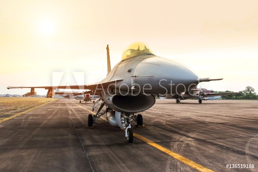 Picture of Falcon fighter jet military aircraft parked in the base airforce on sunset 